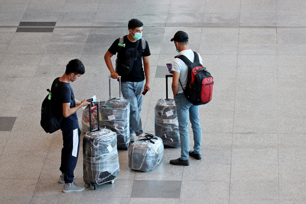 Central Asian migrants in the airport